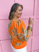 Jincy's Women's Boutique Spring Styles orange embroidered floral top