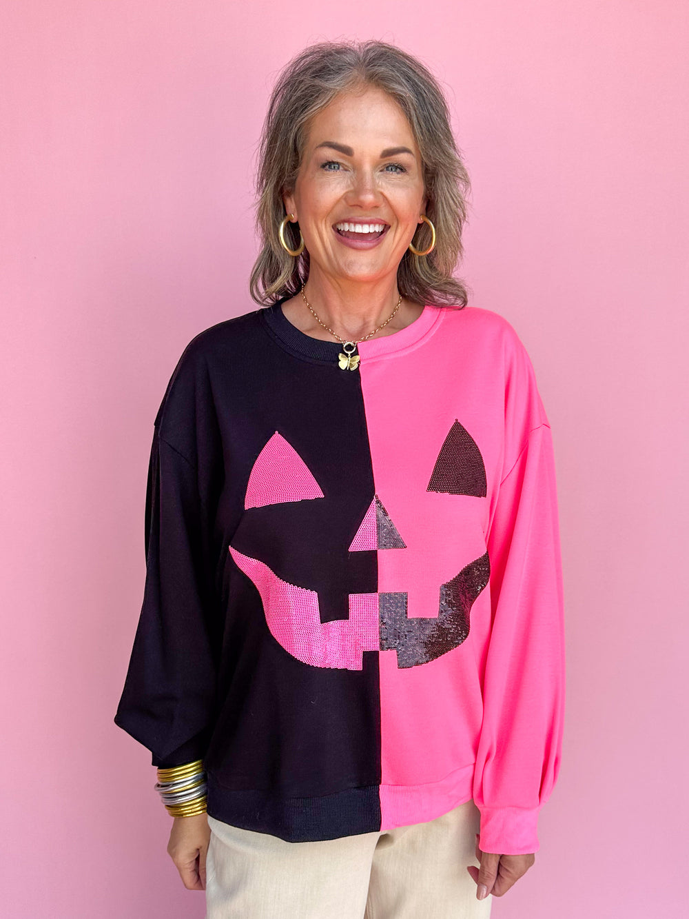 QUEEN OF SPARKLES | Black & Neon Pink Split Pumpkin Face Sweatshirt