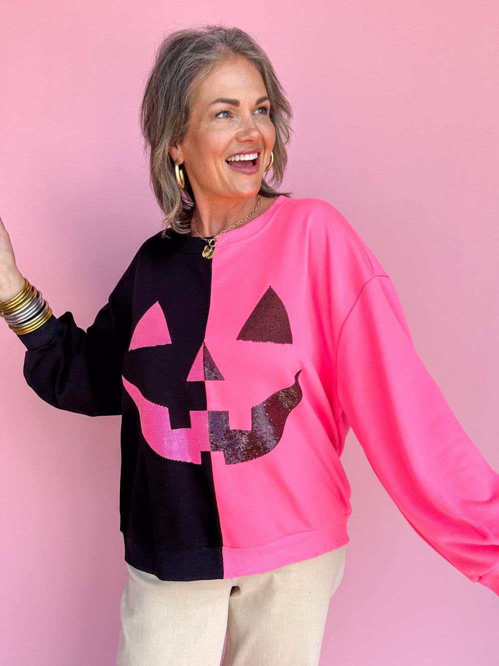 QUEEN OF SPARKLES | Black & Neon Pink Split Pumpkin Face Sweatshirt